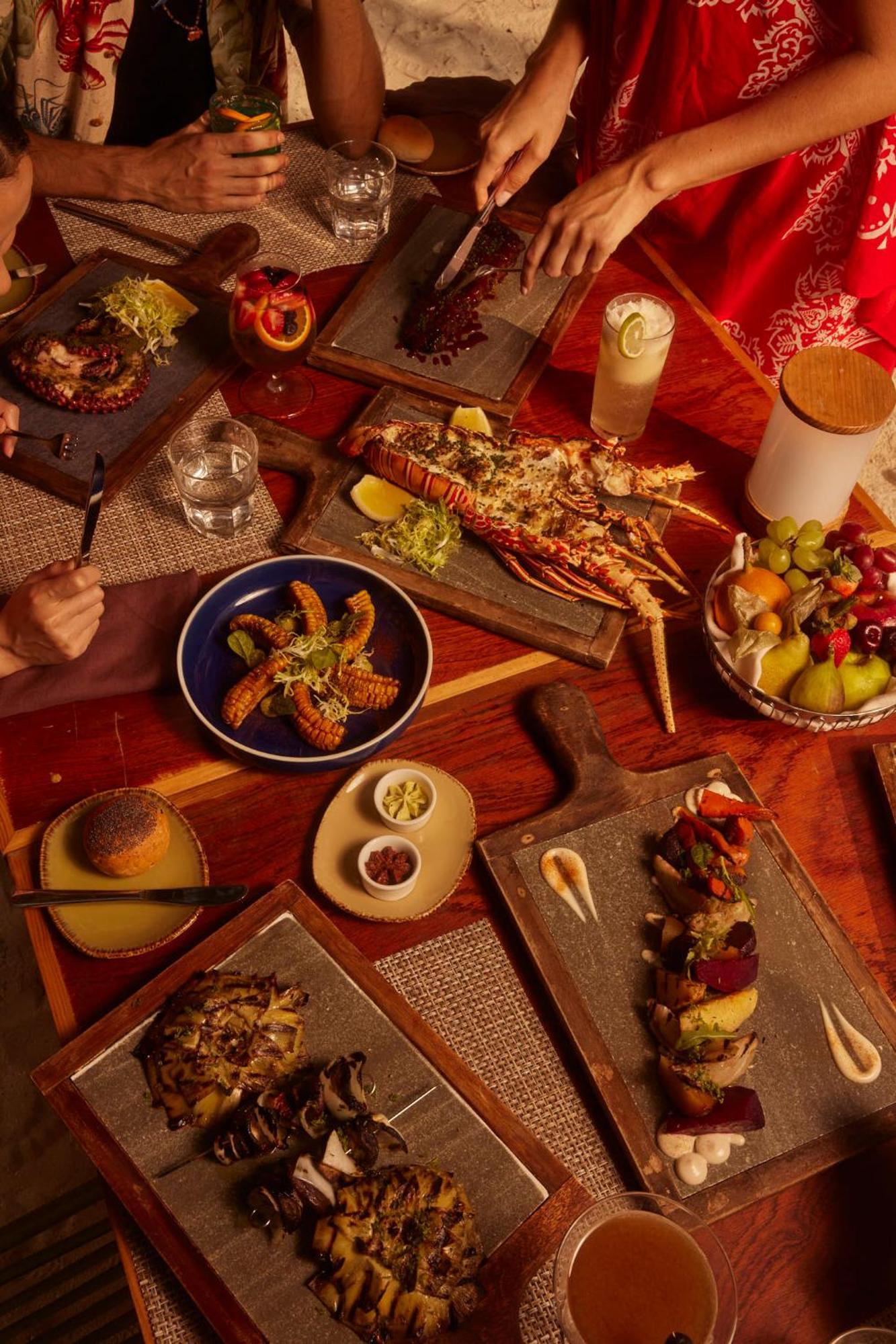 The Standard, Huruvalhi Maldives (Adults Only) Meedhoo  Exterior photo A selection of tapas